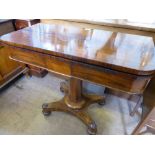 A Rosewood Card Table, supported on pedestal base with four carved bun feet on casters, blue baize