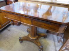 A Rosewood Card Table, supported on pedestal base with four carved bun feet on casters, blue baize