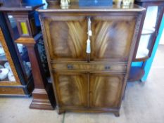 A Reproduction Mirror Backed Drinks Cabinet, single drawer to centre, twin cupboards beneath, approx