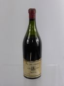 A Bottle of Burgundy, the label reads 'Beaune' Nr 247 France, retailer EIWS Ltd dated 1874.