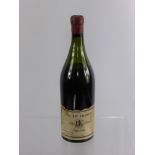 A Bottle of Burgundy, the label reads 'Beaune' Nr 247 France, retailer EIWS Ltd dated 1874.