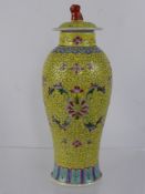 A Chinese Yellow Glaze Baluster Vase and Cover, with floral decoration and Foo Dog finial, approx 27