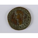 A Bronze Roman Coin, depicting Agrippina to one side and her three daughters to the other,