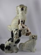 Two Porcelain Fireside Staffordshire Spaniels, with hand painted expressions, approx 34 and 44 cms