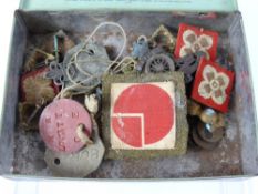 A Box Containing Miscellaneous Military Badges, collar pips, cap badges, buttons, coins, dog tags.