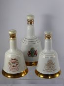 Three Royal Commemorative Bell's Scotch Whisky (75 cl, 50 cl and 50 cl) in the shape of porcelain