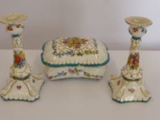 A Continental 'Imperial' Porcelain Trinket Box and Matching Candle Sticks, decorated with floral