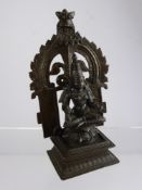 An Antique Bronze Three Part Travelling Deity, depicting a goddess seated on a square base with