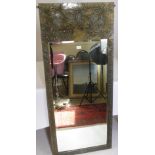 An Arts & Crafts Brass Framed Wall Mirror, the frame embossed with oak leaf and acorn design, the