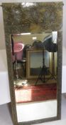 An Arts & Crafts Brass Framed Wall Mirror, the frame embossed with oak leaf and acorn design, the