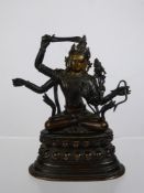 A Fine Late 18th/early 19th Century Sino-Tibetan Gilt Bronze Figure of Manjusri, seated upon a