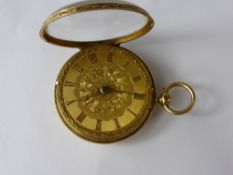 An 18 Ct Yellow Gold Open Face Pocket Watch, the watch having a floral engraved case and dial with