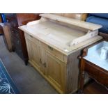 An Antique Pine Side Board, with two cupboards and two drawers beneath a galleried surface, approx