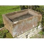 An Antique Rectangular Red StoneTrough, approx 39 x 103 x 62 cms.