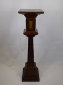 An Arts & Crafts Mahogany Torchere, central column supported on a quadruple plinth with ceramic