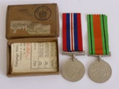 A WW2 Defence and War Medal, in original box.