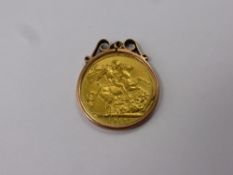 A 1912 George V Gold Full Sovereign, in 9 ct gold mount.