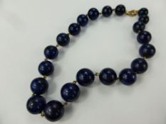 A Graduated Lapis Lazuli and 9 ct gold necklace, approx 38 cms, largest bead approx 15 mm,