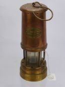 A Copper and Brass Hockley Lamp and Limelight Company Miner's Lamp.