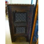 A North African Spice Cupboard, with decorative carving, the interior fitted with single shelf,
