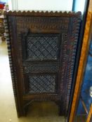 A North African Spice Cupboard, with decorative carving, the interior fitted with single shelf,