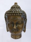 An Aged Brass Sino-Tibetan Style Buddha Head. The head having character marks to base, approx 15 cms