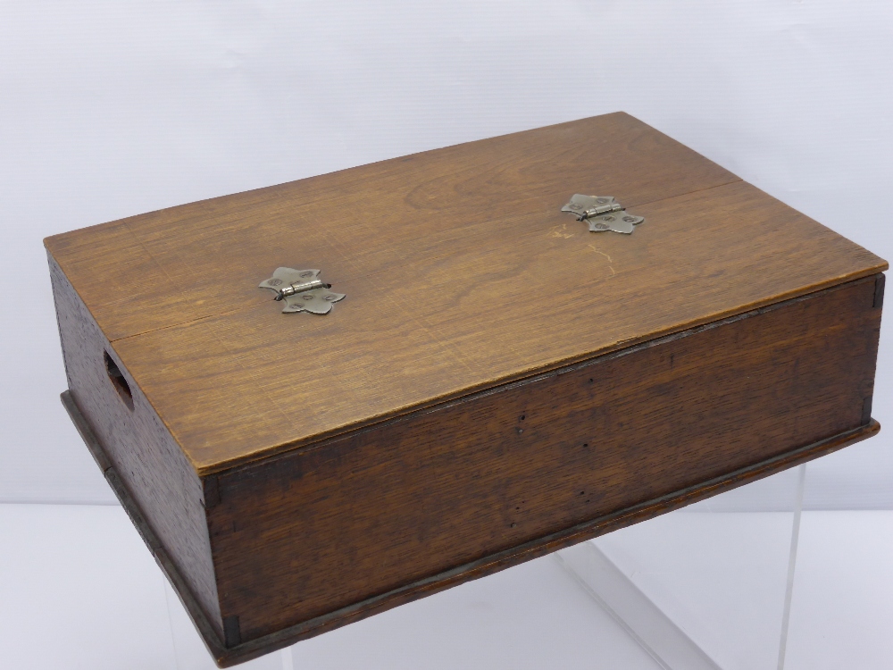 A Wooden Stationary Box, with three compartments beneath a hinged lid.