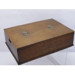 A Wooden Stationary Box, with three compartments beneath a hinged lid.
