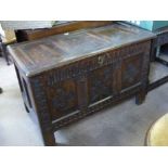 An Antique English Oak Stained Coffer, with decorative carving to front panel with floral carving to