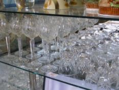 A Large Quantity of Cut Glass, including twelve long stem wine glasses, six short stem glasses,