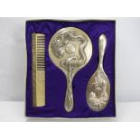 An Early Century Chinese Export Silver Dressing Table Set, comprising hand mirror, hair brush and