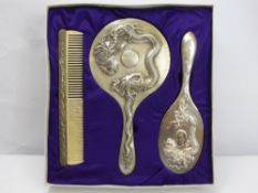 An Early Century Chinese Export Silver Dressing Table Set, comprising hand mirror, hair brush and