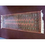 A Contemporary Pink Woollen Runner, with central floral gül, approx 190 x 66 cms.