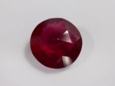 A Round Purple/Red Topaz Loose Stone, 32.23 ct, 21.4 x 9.3 mm.