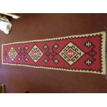 A 20th Century Turkish Tekke Woollen Kilim, of geometric design, maroon, beige and black runner,