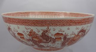 A Chinese Fine Porcelain Bowl, depicting dragon and bird of prey to centre with chasing dragons to