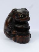 Meiji Period Japanese Netsuke, intricately carved box wood netsuke, depicting a Shi-Shi Masked