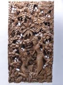 An Indonesian Wooden Carved Panel, depicting a lady huntress in the forest, approx 27 x 50 cms.
