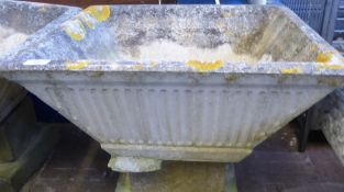 Two Square Tapering Composite Stone Garden Planters, raised on plinths. (2)