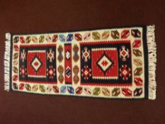 A 20th Century Turkish Tekke Woollen Kilim, multi coloured of geometric design, approx 113 x 50