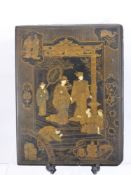 An Antique Chinese Black Lacquer Panel, depicting a scene at court of an Emperor and Empress, approx