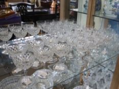 A Set of Twelve Cut Glass Sherry Glasses together with six cut glass liqueur glasses.18)