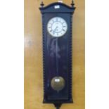 A Viennese Wall Clock, in an ebony case with white enamel face and Roman dial, approx 100 x 28