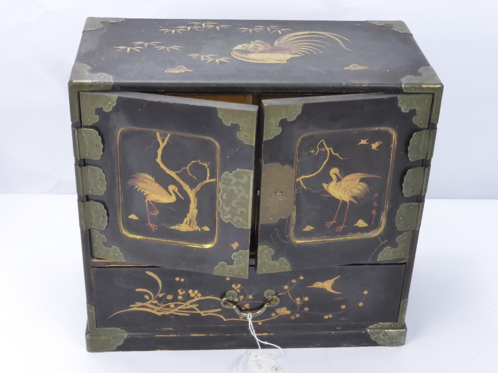 A Chinese Black Lacquer Jewellery Box, with six internal drawers beneath two cupboards, decorated