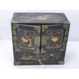 A Chinese Black Lacquer Jewellery Box, with six internal drawers beneath two cupboards, decorated