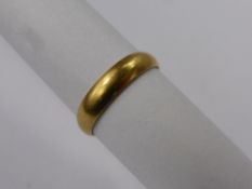 An 18 Ct 750 Hallmark Welsh Gold Wedding Band, mm C.R., size T, wr 3.5 gms.