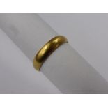 An 18 Ct 750 Hallmark Welsh Gold Wedding Band, mm C.R., size T, wr 3.5 gms.