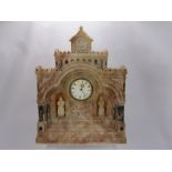 A Hand Carved Marble Clock Carved in the Form of a Church Building, having two hand carved religious