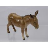 A Beswick Porcelain Figure of a Donkey.