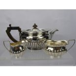 A Silver Tea Trio comprising tea pot, milk jug and sugar bowl, tea pot London hallmark dd 1805, mm